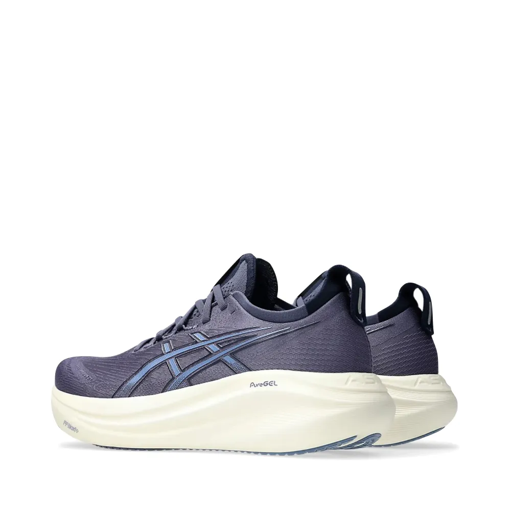 Asics Men's Gel-Nimbus 27 Sneaker in Indigo Fog/Denim Blue running in the mountains