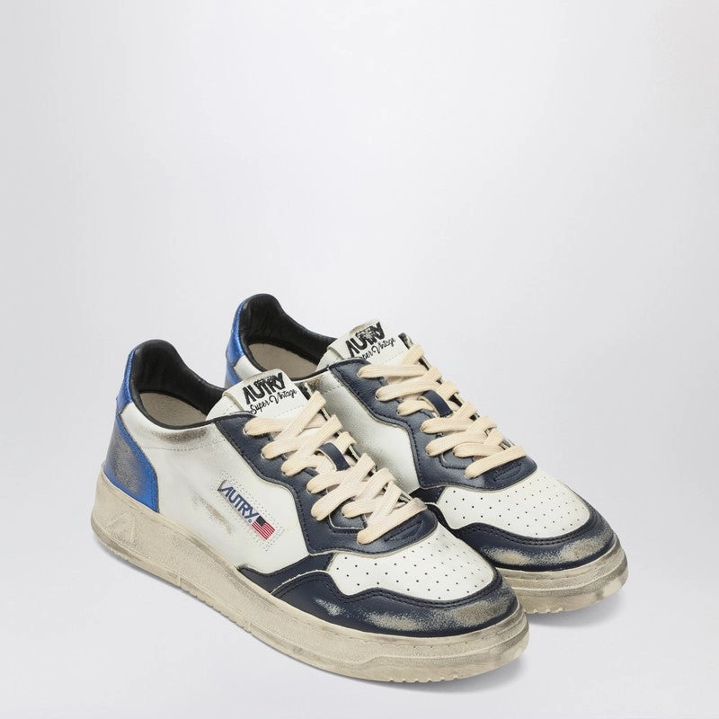 Autry Men's //blue Medalist Low Super Vintage Sneakers color - orange running in poorly - maintained tracks shoes
