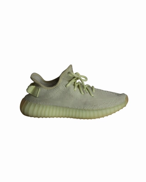 Adidas Yeezy Boost 350 V2 Knit Sneakers in Ice Yellow Cotton running on uneven ground