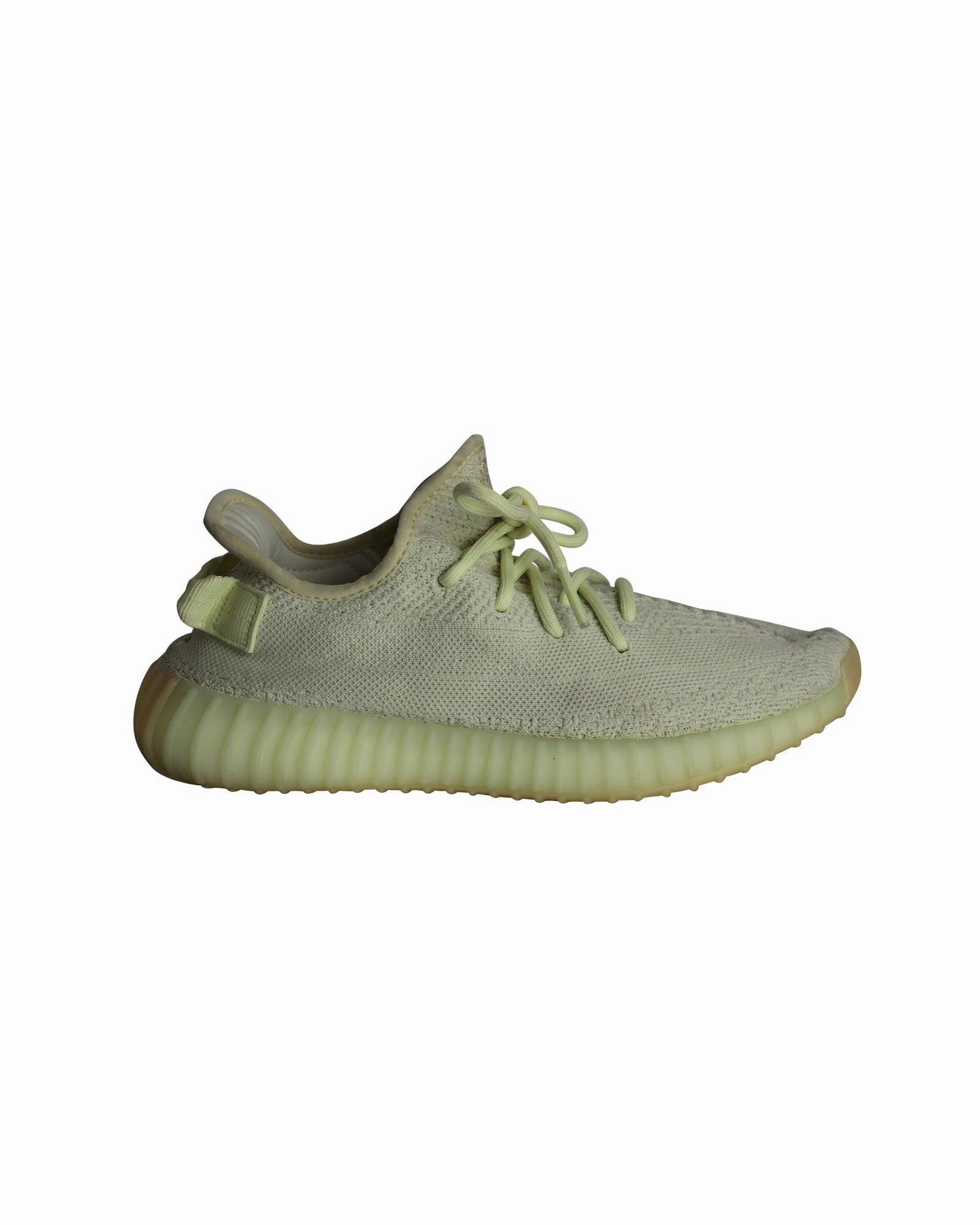Adidas Yeezy Boost 350 V2 Knit Sneakers in Ice Yellow Cotton running on uneven ground