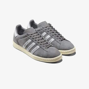 Men's Campus Human Made Sneakers In Grey Suede / White Stripes running in a tram station area shoes