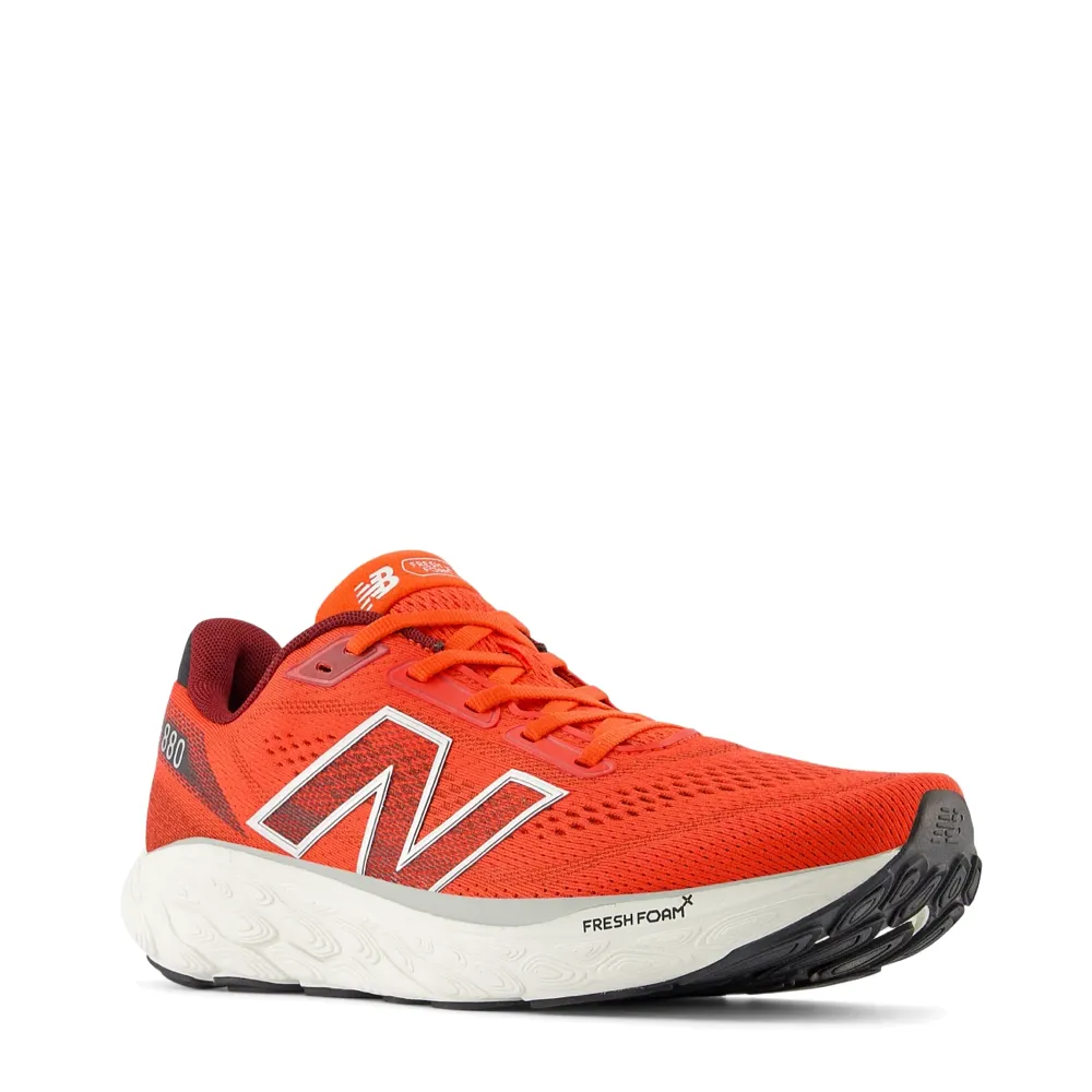 New Balance Men's Fresh Foam X 880v14 in Neo Flame with Mercury Red running in a canal area shoes Outstanding support